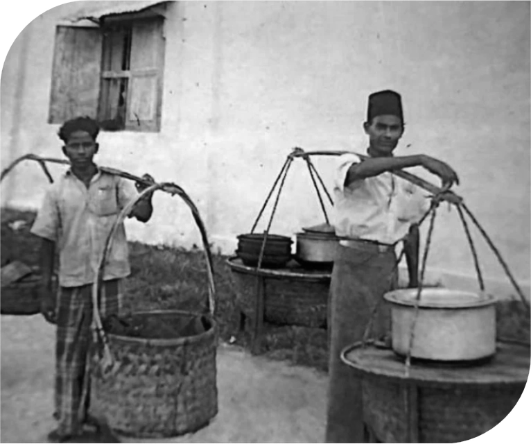 Two people hanging a pot of Nasi Kandar at RB Bistro, the top restaurant in Malaysia